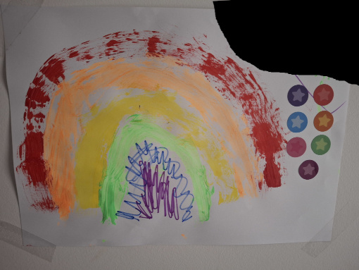 A painting of a rainbow with a slightly creative palette and some marker scribbles added in to help with the colours that we could not easily create with paint at the time. There are some star stickers on this one too.